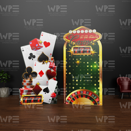 Colorful hotel casino theme party backdrop featuring playing cards and a roulette wheel for events